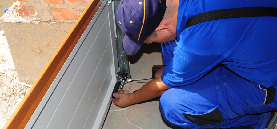 New garage door weather stripping installation